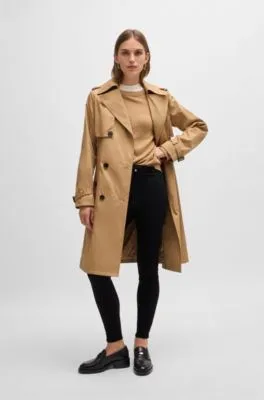 Double-breasted trench coat with buckled belt